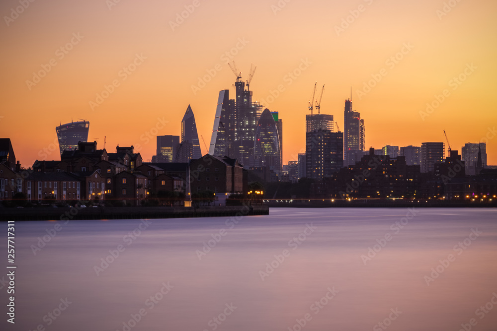 Illuminated London cityscape with beautiful sunset