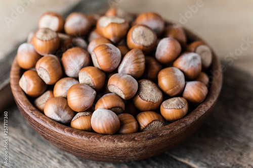 Hazelnuts on rustic wooden background. Food background. Print for kitchen