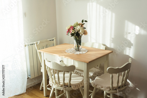 Nicely decorated living ( lunch ) room. Dining table and some chairs. © Nana_studio