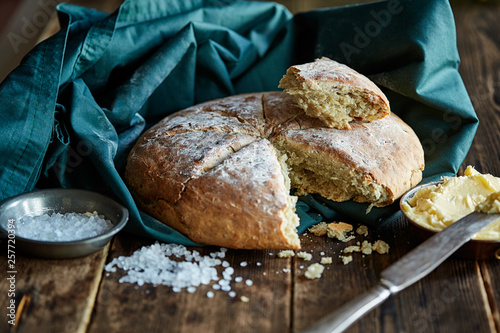 Freshly baked bread with soft butter and coarse salt