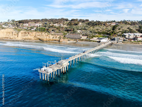 Aerial view of the scripps pier institute of oceanography, La Jolla, San Diego, California, USA. Research pier used to study ocean conditions and marine biology.  Pier with luxury villa on the coast.