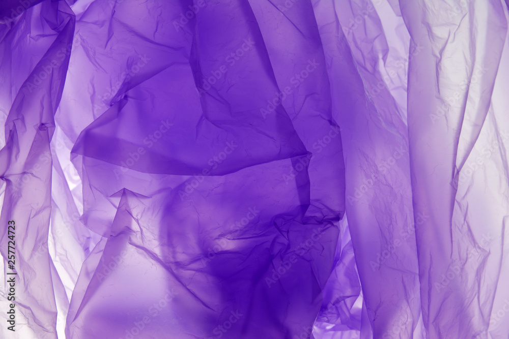 Plastic bag background. Plastic concept. Violet background. For the text, textures, banners, leaflets, posters, with space for inscriptions.