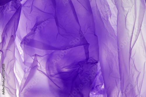 Plastic bag background. Plastic concept. Violet background. For the text, textures, banners, leaflets, posters, with space for inscriptions.
