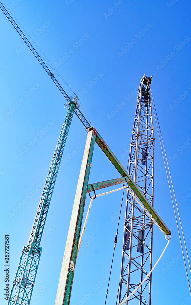 Cranes against the sky, Barcelona, Catalunya, Spain, Europe Cranes against the sky, Barcelona, Catalunya, Spain, Europe