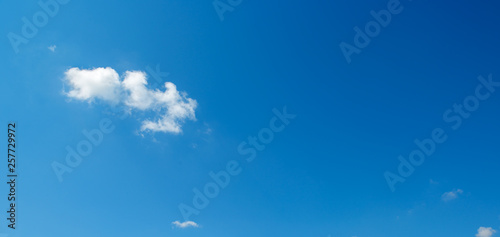 Small white clouds against blue sky.