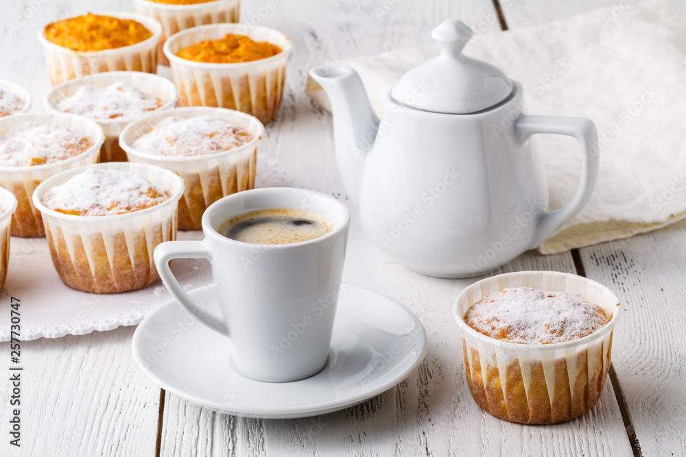 sweet pumpkin muffins with walnuts and powdered sugar