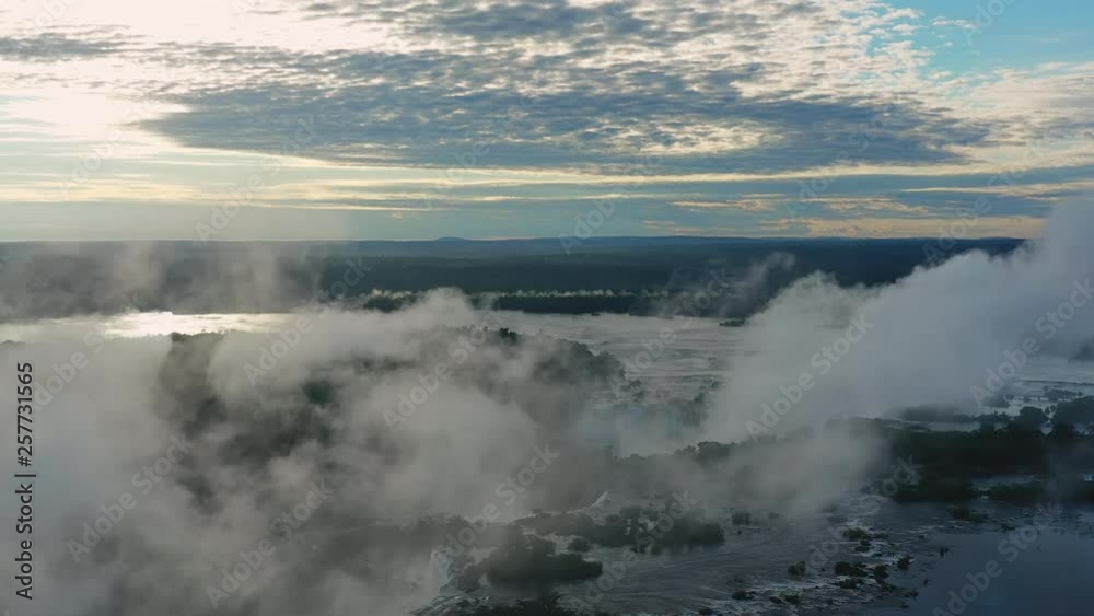Aerial view of Iguazu Falls at sunrise, monumental waterfalls on Iguazu River - landscape panorama of Brazil/Argentina border, South America Aerial view of Iguazu Falls at sunrise, monumental waterfalls on Iguazu River - landscape panorama of Brazil/Argentina border, South America