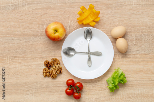 clock fruit plate on wooden background