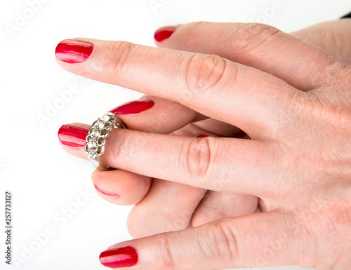 Woman putting on a silver ring