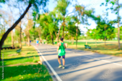 Blurred green city public park people exercise