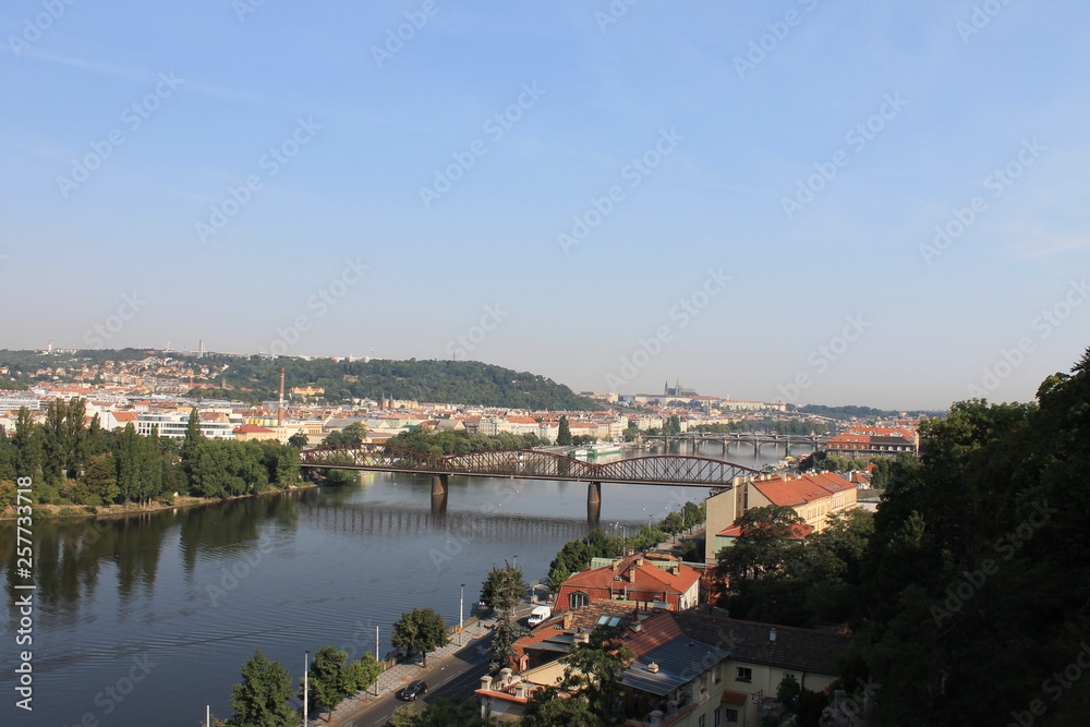 Panoramic view of Prague and the railway bridge over the Vltava river in the Czech Republic