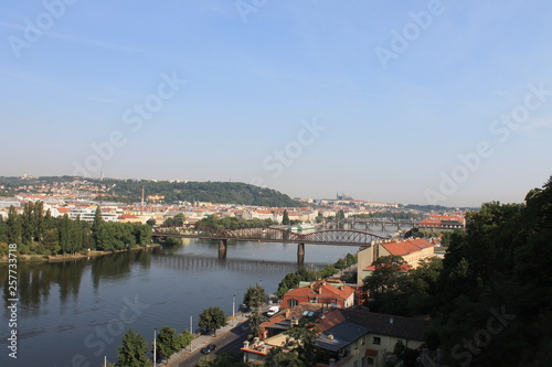 Panoramic view of Prague and the railway bridge over the Vltava river in the Czech Republic