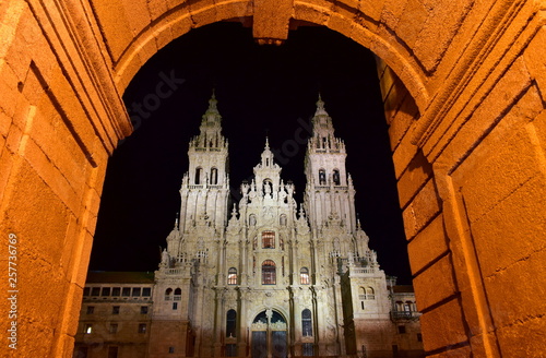 Cathedral at night from Town Hall arch, Palacio de Rajoy. Baroque facade and towers. Santiago de Compostela, Plaza del Obradoiro. Spain.  photo