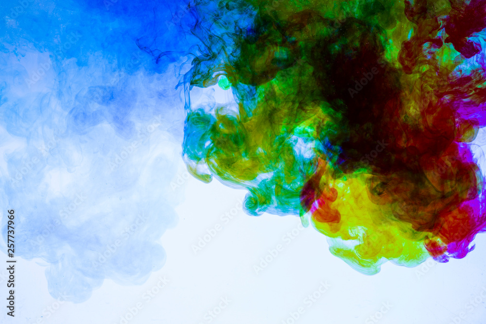 colorful paints dissolve in water, abstract background