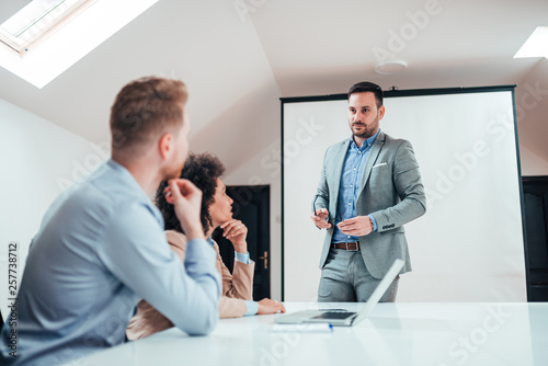 Business presentation in a meeting room, low angle image.