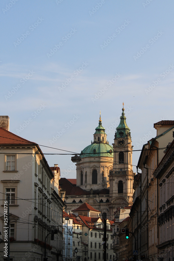 View of the dome and bell tower of St. Nicholas Catholic Church in Prague