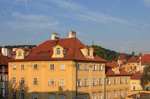 Historic yellow house with red tiled roof in Prague's old town