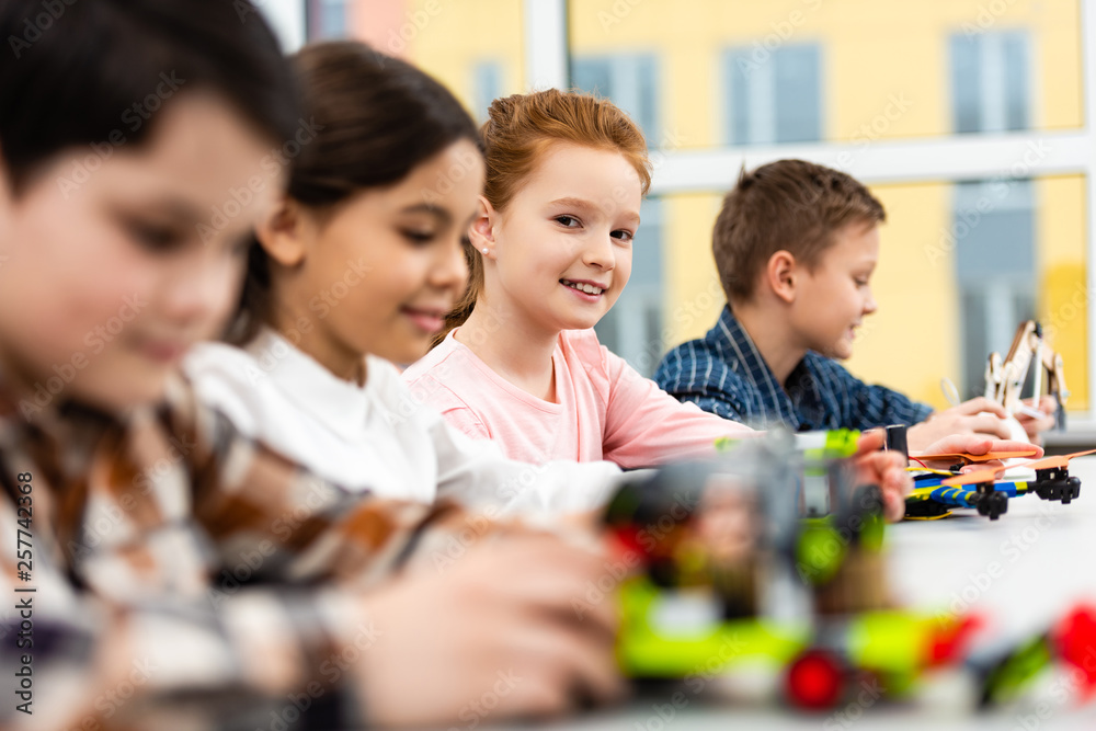Pupils sitting at desk with toys during lesson in classroom Pupils sitting at desk with toys during lesson in classroom