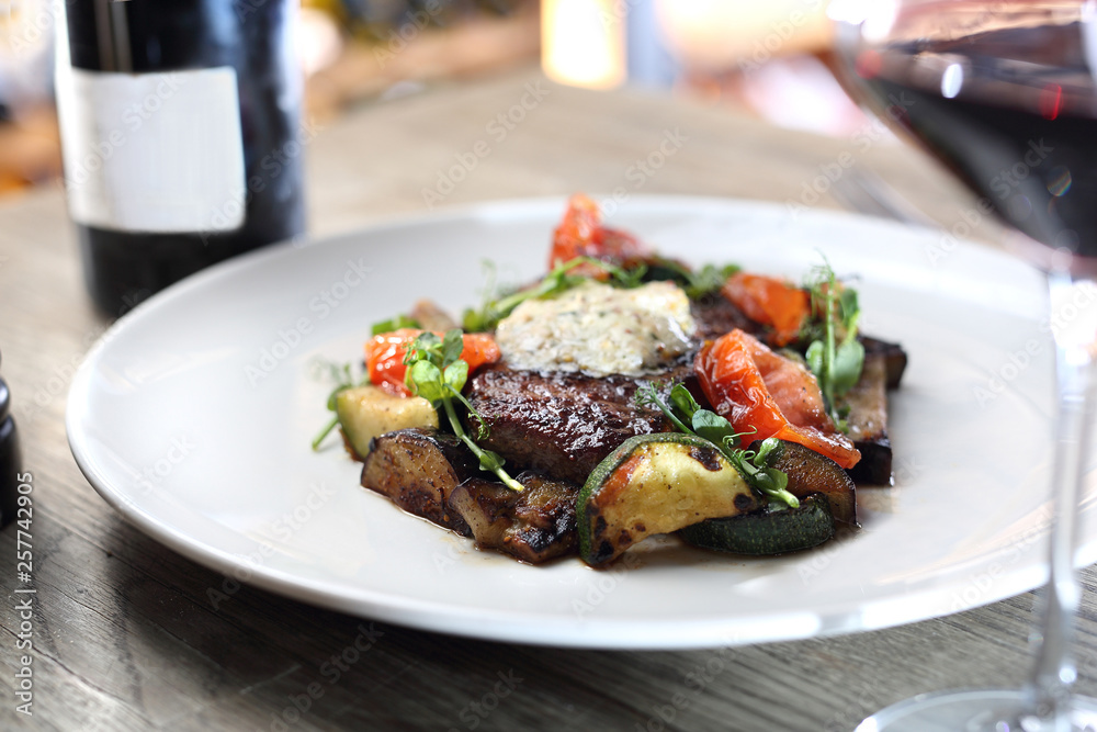 Beef steak with herb butter and grilled vegetables Beef steak with herb butter and grilled vegetables
