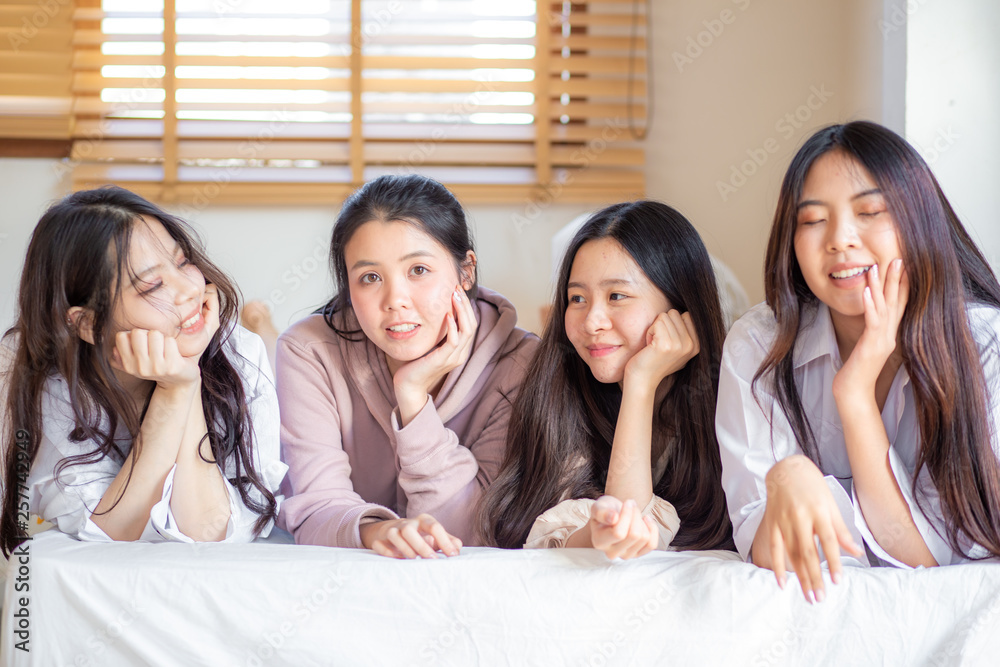 Group of pretty young asian women friend on bed Group of pretty young asian women friend on bed