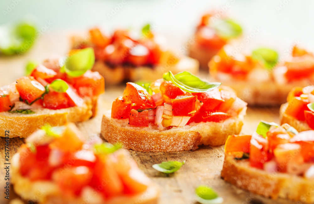 Classic italian bruschetta served on wooden board Classic italian bruschetta served on wooden board