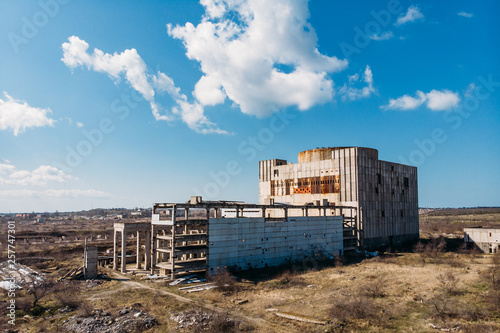Abandoned and ruined Nuclear Power Plant in Shelkino, Crimea. Large USSR industrial construction with round tower of atomic reactor