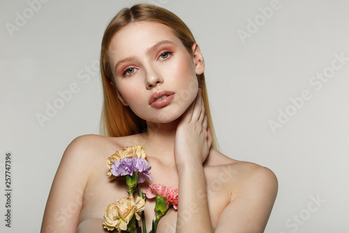 Beautiful woman portrait with bright art makeup and blonde hair