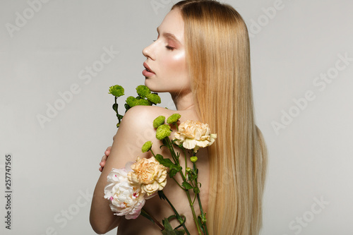 Beautiful young blonde girl with closed eyes