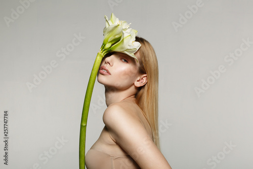 Portrait of a young attractive girl with beautiful make-up, long hair, perfect skin
