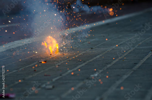 Firecrackers exploding in the street for the Fallas celebration in Valencia. photo