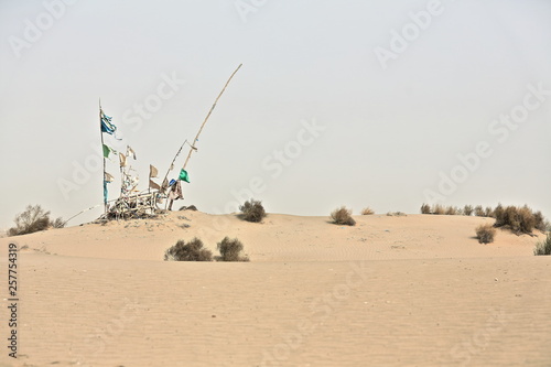 Votive flags-burial mound-Imam Asim's mazar or mausoleum area-Taklamakan Desert. Hotan-Xingjiang-China-0059 photo