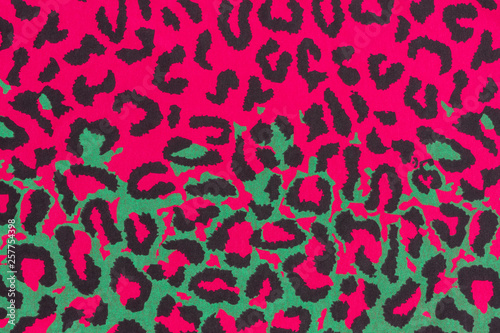 Abstract colorful leopard unreal and futuristic print. Composed from pink green and black.