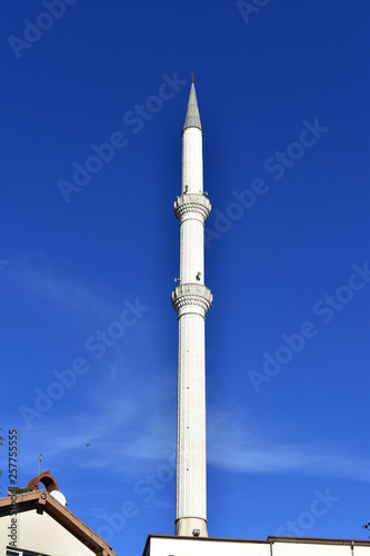 white minaret with clear sky against the background