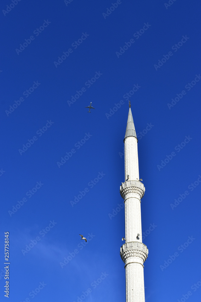 white minaret with clear sky against the background white minaret with clear sky against the background