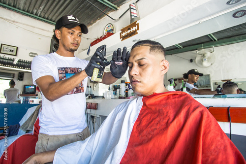 young latinos in traditional barbershop