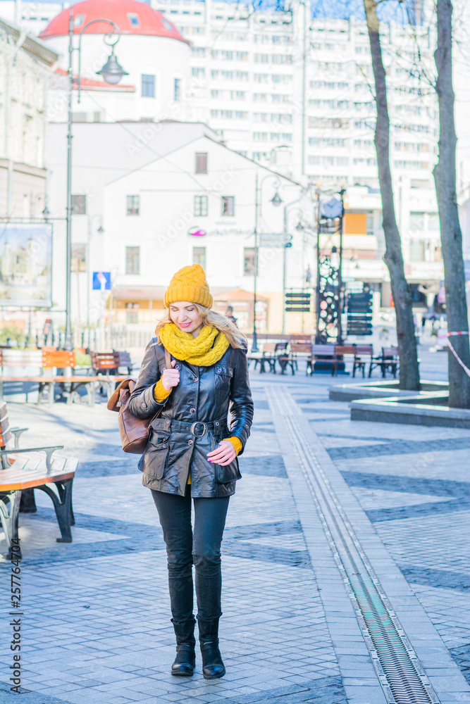 beautiful young woman walking on the street spring time beautiful young woman walking on the street spring time