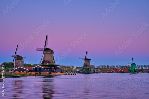 Windmills at Zaanse Schans in Holland in twilight on sunset. Zaa