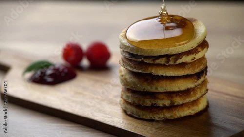 Stack of Pancakes with Honey and Raspberry