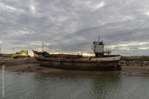 An old ship in the beach of Tavira (Portugal)