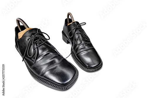 old varnished shoes on a white background