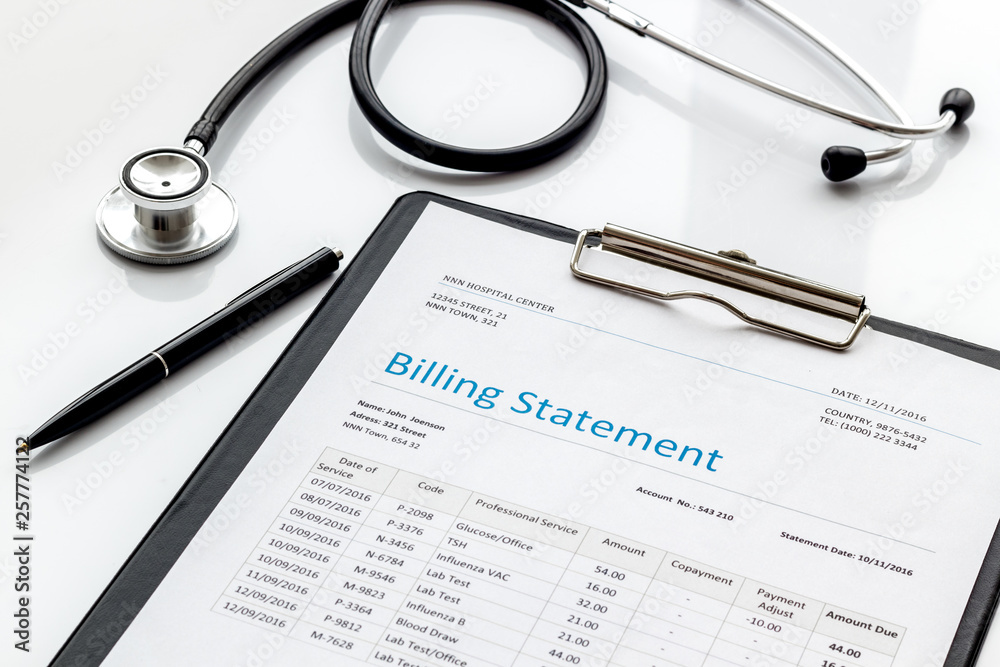 medical treatment bill and phonendoscope on white background medical treatment bill and phonendoscope on white background