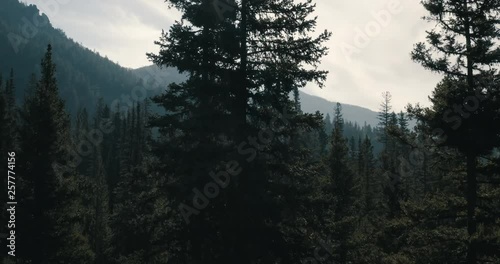 Opening reveal shot above wide open Montana mountain valley.