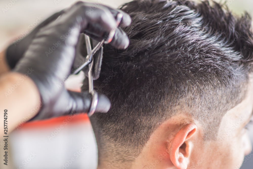 men's haircut with scissors, traditional Latin American