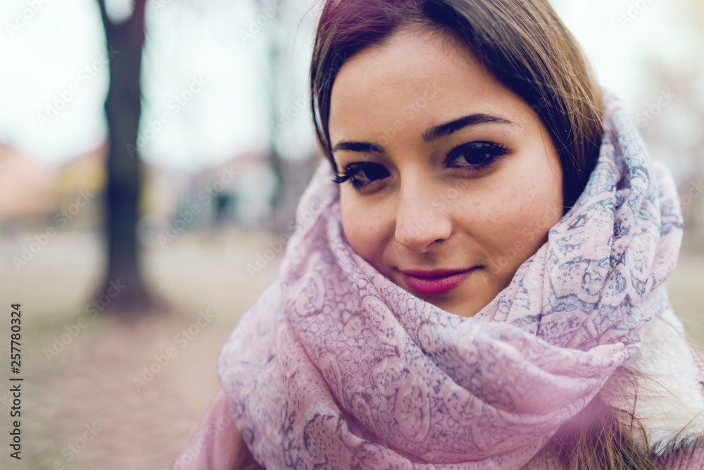 Portrait of young teenage girl in spring at Park with scarf Portrait of young teenage girl in spring at Park with scarf