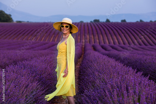 asian woman in yellow dress and hat at lavender field