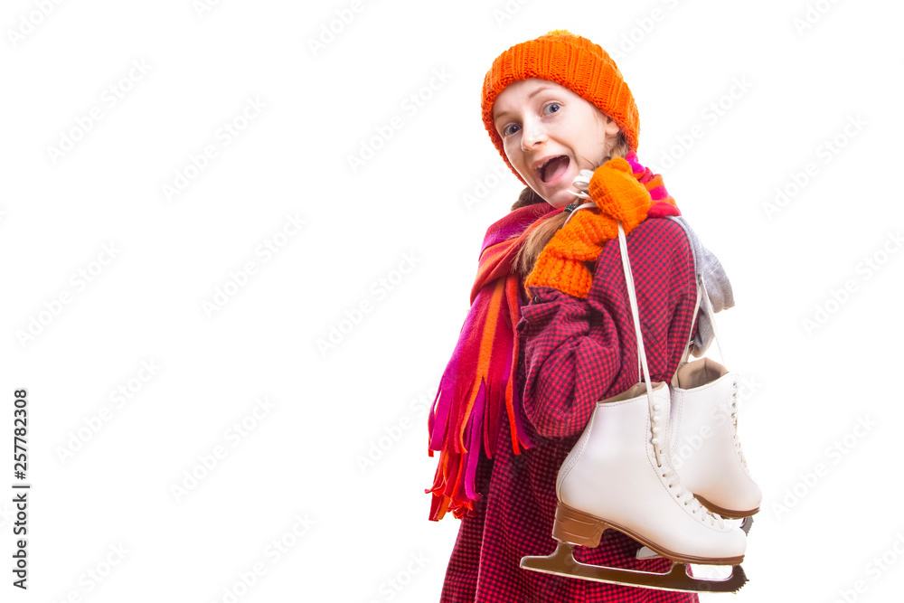 Portrait of Exclaiming Caucasian Girl in Winter Clothes Posing with Ice Skates In Both Hands Against Pure White Background