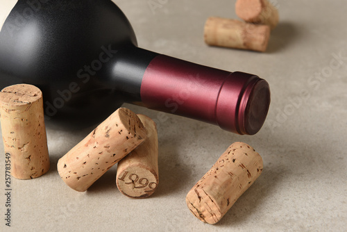 Closeup of a Red Wine Bottle with Corks and Corkscrew