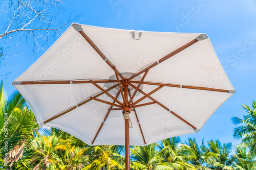 Beautiful landscape of sea ocean on sky with umbrella and chair around luxury outdoor swimming pool