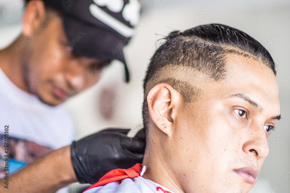 day in traditional barbershop, man cut hair day in traditional barbershop, man cut hair