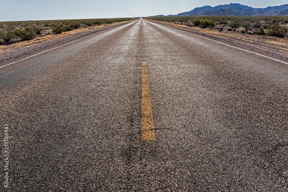 Naklejka premium A long, straight, narrow road in the Grand Canyon.